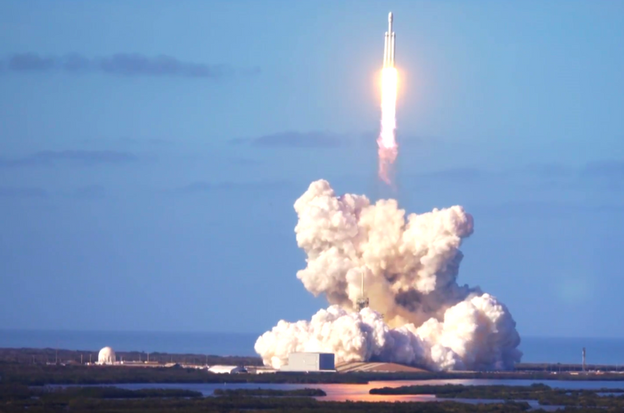 Spacexs Falcon Heavy Rocket Flies A Tesla Roadster Into